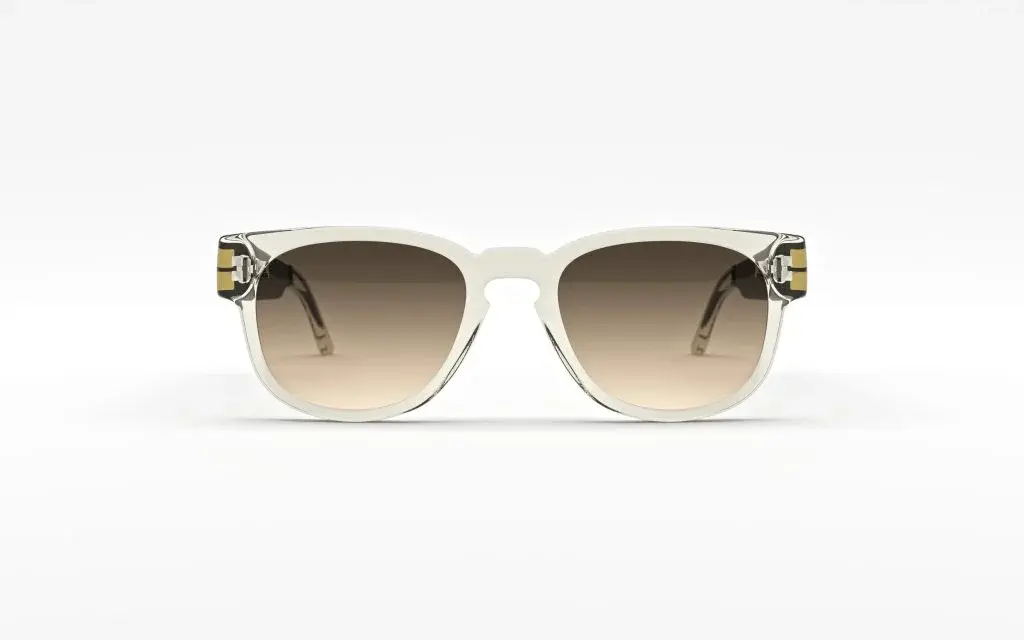 A pair of stylish sunglasses with a white frame and gradient tinted lenses sits against a plain background.