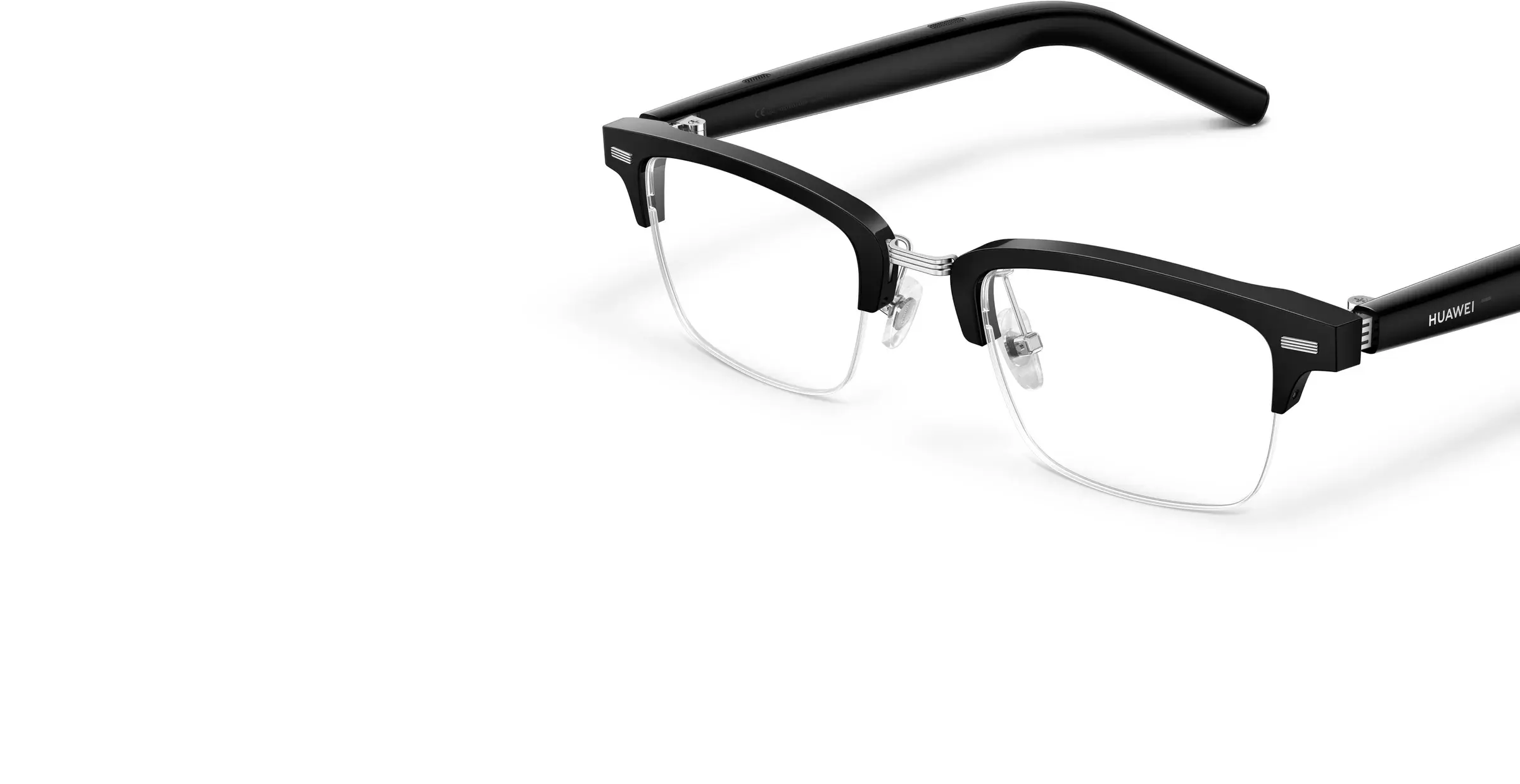 A pair of Huawei Eyewear 2 smart glasses with a sleek black frame and transparent lenses displayed against a white background.