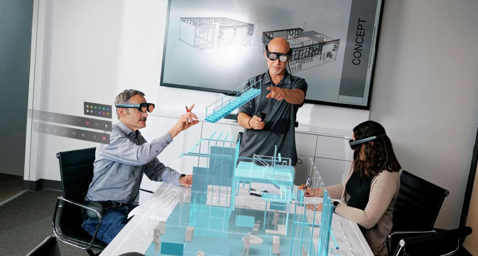 Three people wearing Magic Leap 2 augmented reality headsets are collaborating over a transparent 3D digital architectural model displayed on a table.