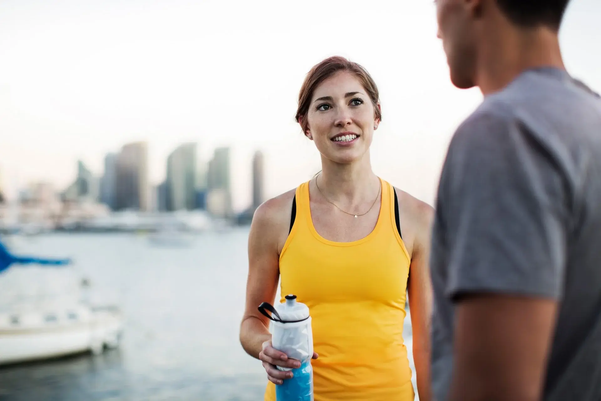 Active couple running outdoors — 24/7 wearer scenario