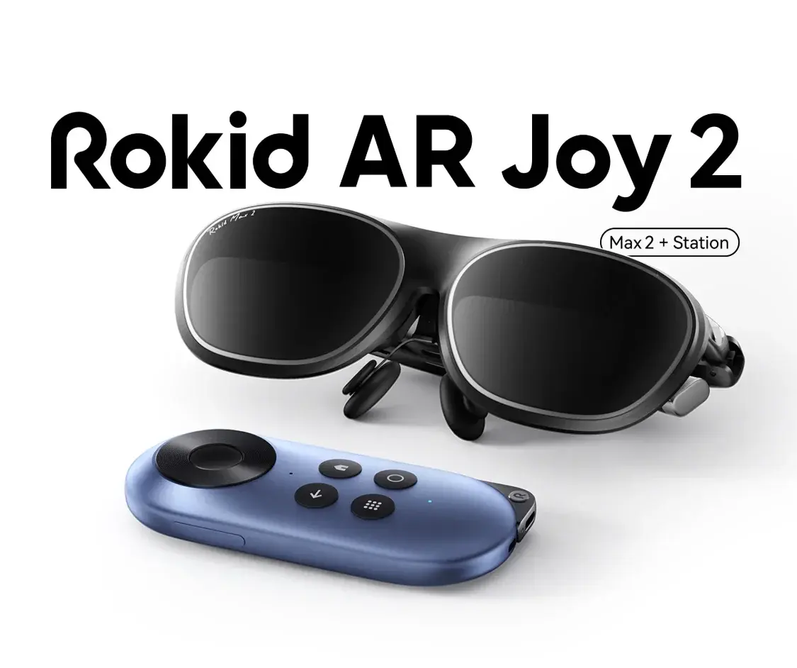 A pair of black Rokid AR Joy 2 glasses with a matching blue controller are displayed, emphasizing the Rokid AR Spatial product's modular setup with a maximum of two glasses and a station.