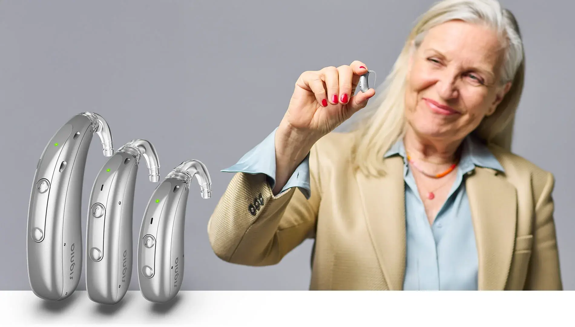 Signia Motion Charge&Go SP IX hearing aid held in hand — size reference